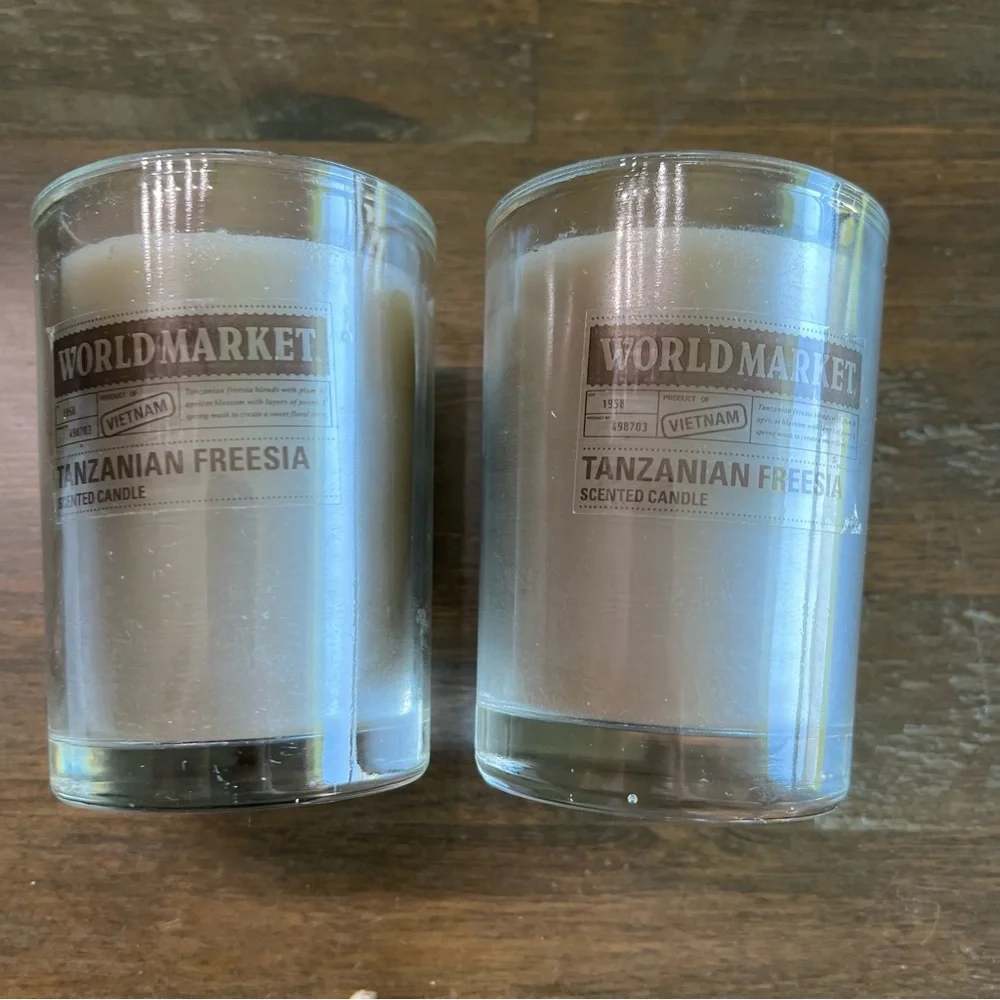 Cost Plus World Market gray Tanzanian Freesia scented candles. Set of 2 3in x 4